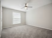 Thumbnail 43 of 57 - an empty room with a ceiling fan and a window at Shellbrook, North Carolina, 27609