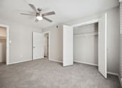 Thumbnail 42 of 57 - an empty bedroom with a ceiling fan and a closet at Shellbrook, Raleigh, North Carolina