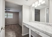 Thumbnail 52 of 57 - an empty bathroom with a large mirror and a sink at Shellbrook, Raleigh, NC, 27609