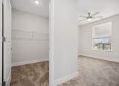 Thumbnail 14 of 47 - Enjoy ample closet and bedroom space, complete with a ceiling fan for ultimate comfort at Centro at Pine Nash, Wilson, 27893