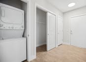 Thumbnail 20 of 47 - Front entry featuring convenient coat closet storage and in-unit washer and dryer  Centro at Pine Nash, Wilson, NC