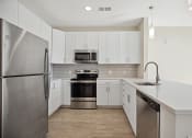 Thumbnail 22 of 47 - Meet your culinary bliss with our featured kitchens designed with ample storage and energy efficient appliances Centro at Pine Nash, Wilson, North Carolina