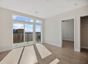 Thumbnail 24 of 47 - A1 Living space filled with natural light and private balcony overlooking downtown Wilson , NC