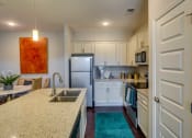 Thumbnail 22 of 29 - White Cabinetry And Appliances In Kitchen at Evolve at Tega Cay, Fort Mill, SC