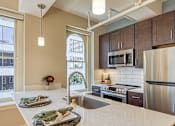 Thumbnail 8 of 16 - Kitchen island at Stumpf Flats Apartments in Richmond Va