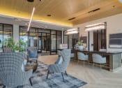 Thumbnail 16 of 38 - the preserve at cardinal woods lobby with chairs and tables at Aura Stonebridge, Richmond, VA 23225