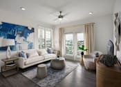 Thumbnail 20 of 42 - A living room with a white couch, a blue abstract painting, a wooden coffee table, and a rug.