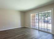 Thumbnail 20 of 39 - an empty living room with a door to a patio