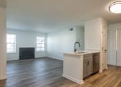 Thumbnail 11 of 56 - A kitchen area with a fireplace and a countertop.