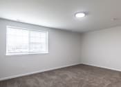 Thumbnail 5 of 36 - an empty room with carpet and a window