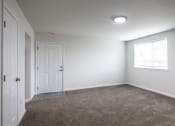 Thumbnail 4 of 36 - an empty room with carpet and a window