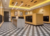 Thumbnail 25 of 38 - the tasting room of the winery with many wine racks and a granite counter top at Aura Stonebridge, Richmond