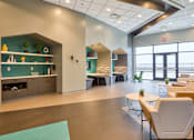 Thumbnail 20 of 40 - A modern office space with a long table and chairs.
