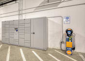 Thumbnail 28 of 40 - A parking garage with a white wall and a parking meter.