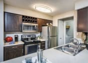 Thumbnail 3 of 27 - Kitchen at Bridges at Chapel Hill Apartments in Carrboro NC