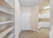 Thumbnail 59 of 67 - A white door is in a room with a wood floor.