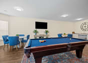 Thumbnail 19 of 27 - a games room with a pool table and a tv