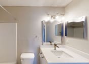 Thumbnail 32 of 40 - a bathroom with a toilet sink and mirror