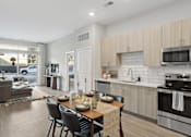 Thumbnail 2 of 24 - Open Kitchen Into Living Room at Innsbrook Square, Glen Allen