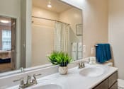 Thumbnail 19 of 24 - a bathroom with two sinks and a large mirror