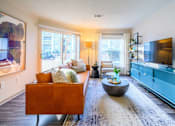 Thumbnail 3 of 20 - A living room with a brown couch and a blue cabinet.