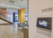 Thumbnail 79 of 88 - A reception area with a sign that says "Package Room".