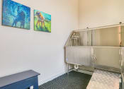 Thumbnail 9 of 53 - a kitchen with a stainless steel refrigerator and paintings on the wallat Blue Ridge Commons Apartments, Roanoke, VA