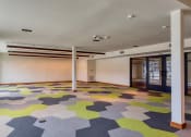 Thumbnail 68 of 81 - a large room with a colorful carpet in the middle of it at Ainsworth, Virginia