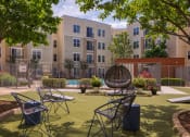 Thumbnail 10 of 60 - a courtyard with tables and chairs at Proximity at ODU, Virginia, 23508