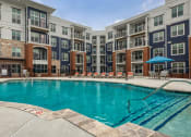 Thumbnail 23 of 42 - our apartments offer a swimming pool in front of our building at The Bella at Westchester, Virginia