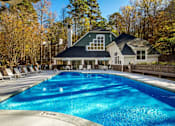 Thumbnail 52 of 67 - A large swimming pool in front of a house.
