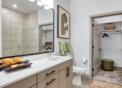 Thumbnail 4 of 38 - a bathroom with a large mirror and a toilet and a showerat Aura Stonebridge, Richmond, VA