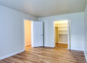 Thumbnail 23 of 24 - an empty room with a closet and an open door at Gates of West Bay in Norfolk, 23503