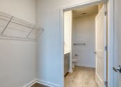 Thumbnail 38 of 47 - an empty bathroom with a closet and a toilet at The Port at East Beach Apartments and Marina, Virginia, 23518