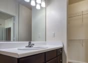 Thumbnail 46 of 60 - a bathroom with a sink and a mirror and a shower at Proximity at ODU, Norfolk