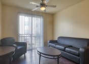 Thumbnail 43 of 60 - living room with a couch and a table at Proximity at ODU, Virginia, 23508