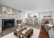 Thumbnail 3 of 67 - A modern living room with a fireplace and a coffee table.