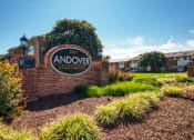 Thumbnail 1 of 15 - the sign apartments in front of a brick wall