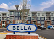 Thumbnail 42 of 42 - an arrow sign in front of an apartment building at The Bella at Westchester, Midlothian, VA, 23113