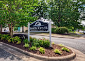 Thumbnail 21 of 21 - A sign for Bridle Creek stands in a landscaped planter.