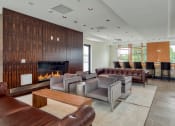 Thumbnail 71 of 81 - a living room with couches and chairs and a fireplace at Ainsworth, Richmond
