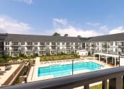 Thumbnail 55 of 81 - a balcony view of an apartment building and a swimming pool at Ainsworth, Richmond