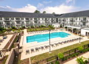 Thumbnail 53 of 81 - an aerial view of an apartment building with a swimming pool at Ainsworth, Richmond, Virginia
