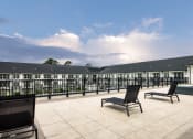 Thumbnail 56 of 81 - a terrace with chairs and tables and a building in the background at Ainsworth, Richmond, Virginia