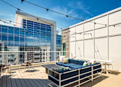 Thumbnail 14 of 36 - Rooftop patio at Helix Apartments in Chesapeake Va
