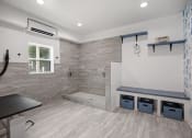 Thumbnail 2 of 22 - a large bathroom with a shower and a sink and a bench