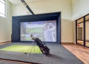 Thumbnail 8 of 81 - a golf bag on a tripod in front of a screen in a room with a at Ainsworth, Richmond, Virginia