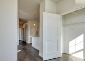 Thumbnail 37 of 47 - an empty living room with white walls and a white door at The Port at East Beach Apartments and Marina, Norkfolk, 23518