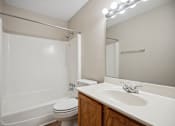 Thumbnail 29 of 33 - a bathroom with a sink toilet and shower and a mirror