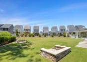 Thumbnail 21 of 29 - a park with a row of houses in the background